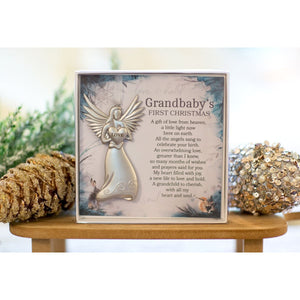3 of 4:Grandbaby's First Christmas angel gift on bookshelf.