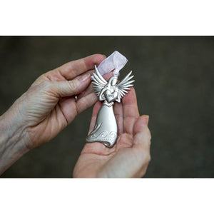 3 of 4:Angel holding a heart with LOVE on it being held in a hand