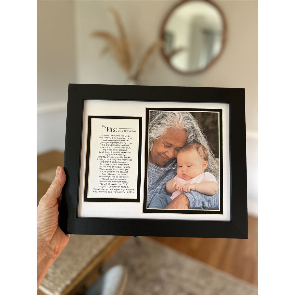 First Great-Grandchild frame being held in a hand.