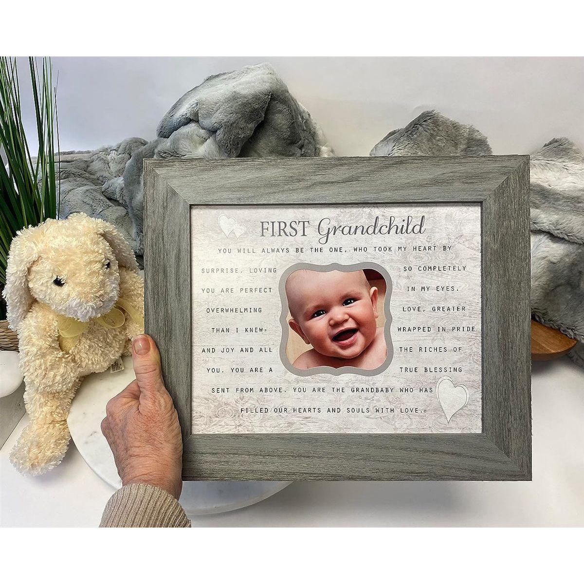 First Grandchild frame being held in a hand.