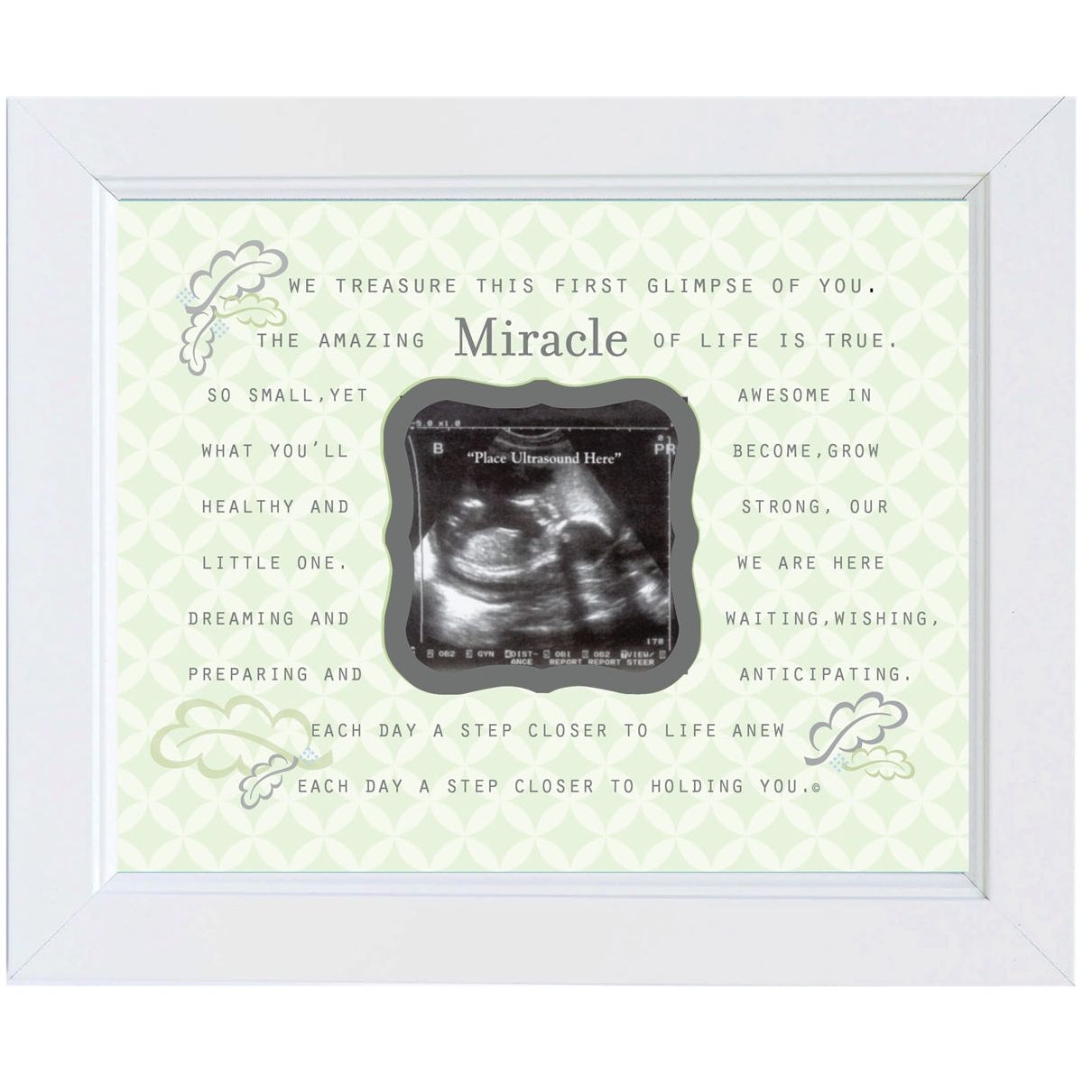Up close view of Miracle artwork and sentiment in distressed white frame.