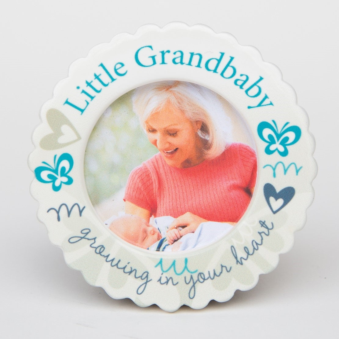 Little Grandbaby Ornament standing up with the easel back.