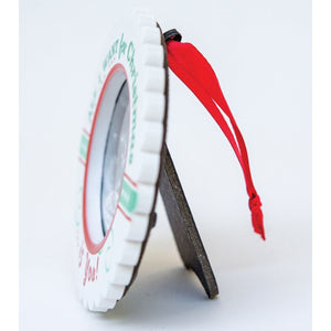 3 of 4:Side view of Baby's 1st Christmas ornament with easel back for tables and red satin ribbon for hanging.