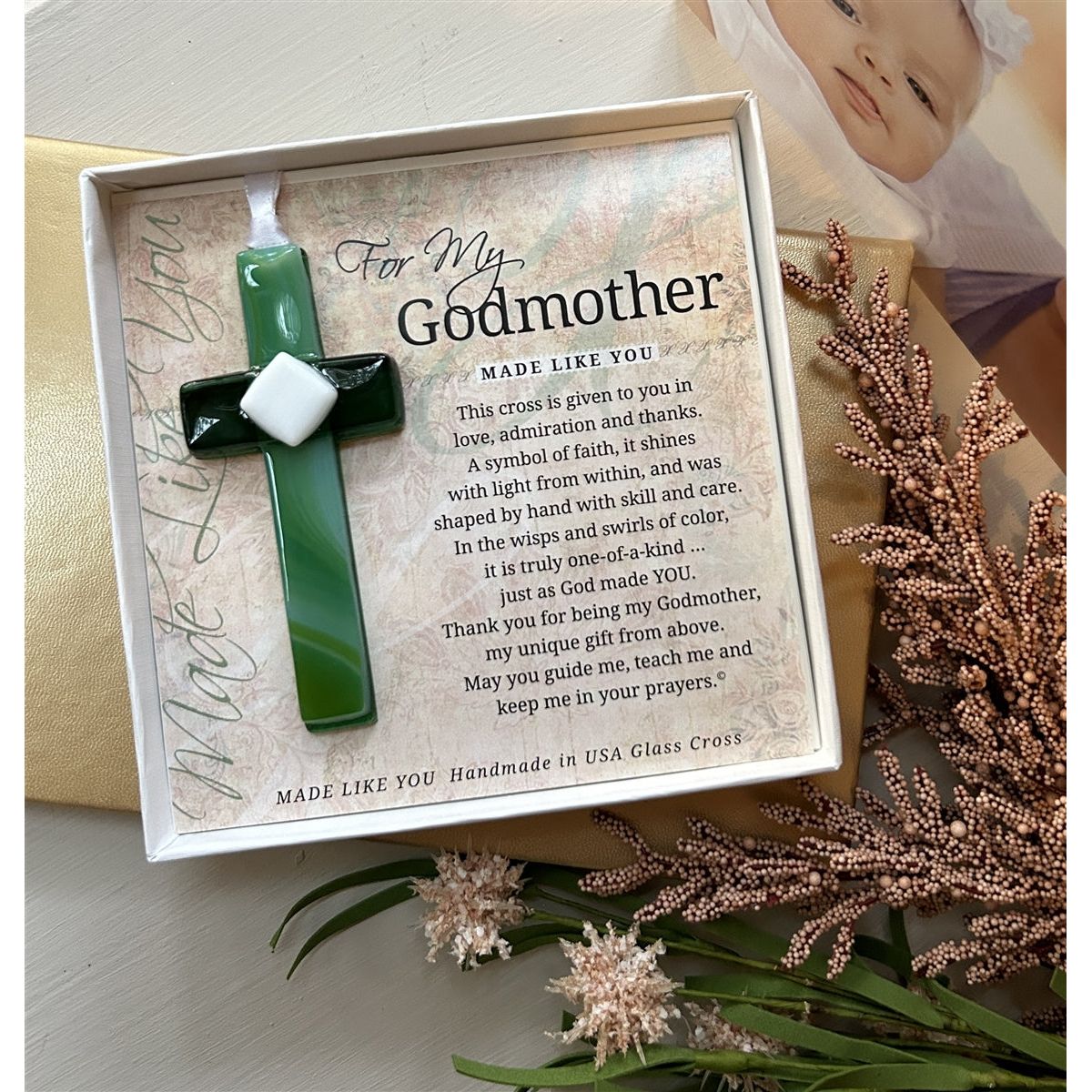 Godmother cross gift on a table.
