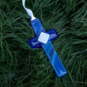 4 of 5:Blue glass cross with white satin ribbon for hanging.