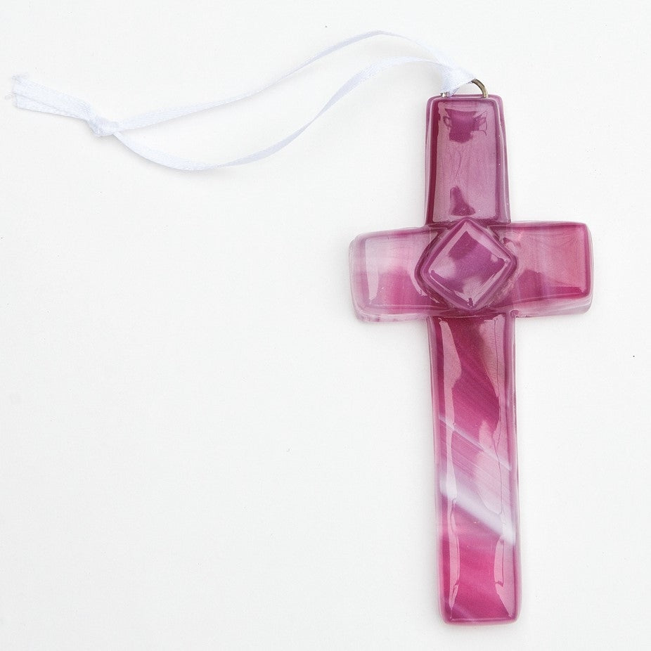 Pink glass cross with white satin ribbon for hanging.