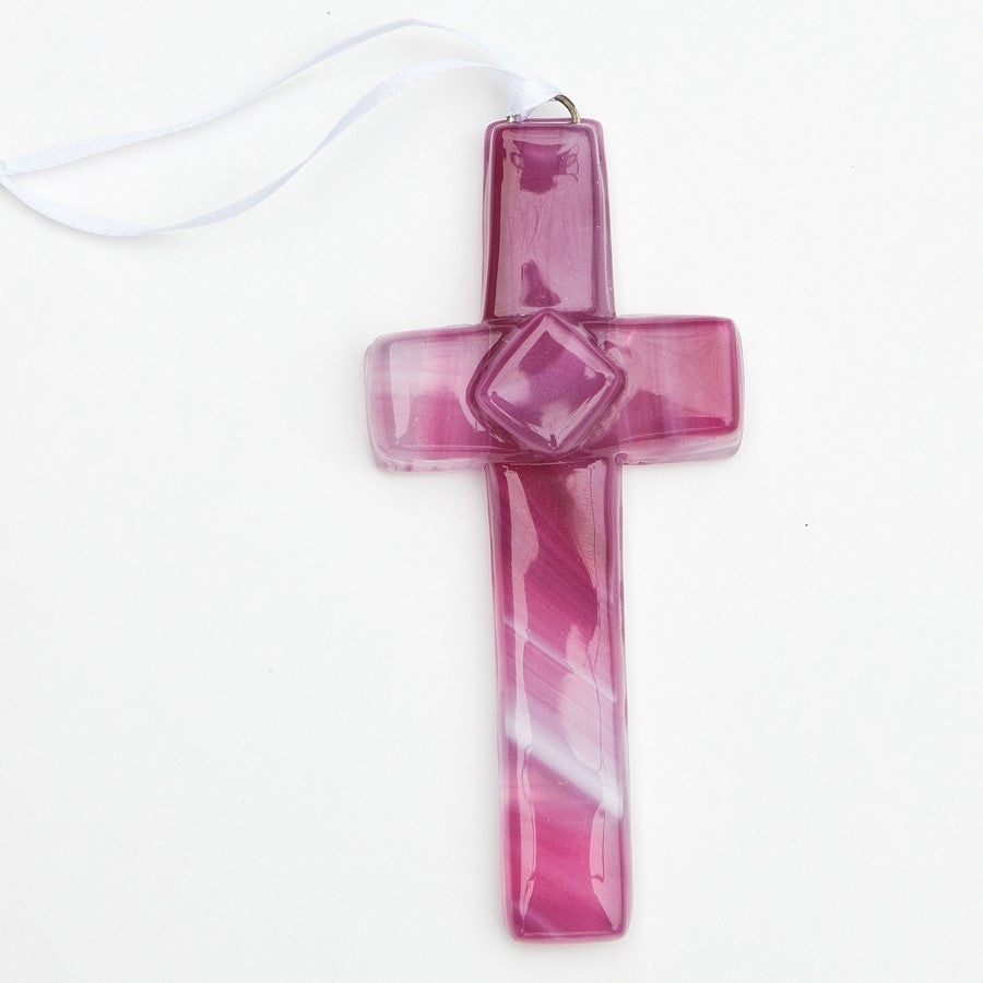 Pink glass cross with white satin ribbon for hanging.