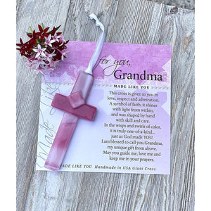 3 of 6:Pink glass cross and artwork with