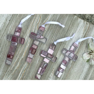 4 of 4:An assortment of pink mosaic crosses, each one is unique.
