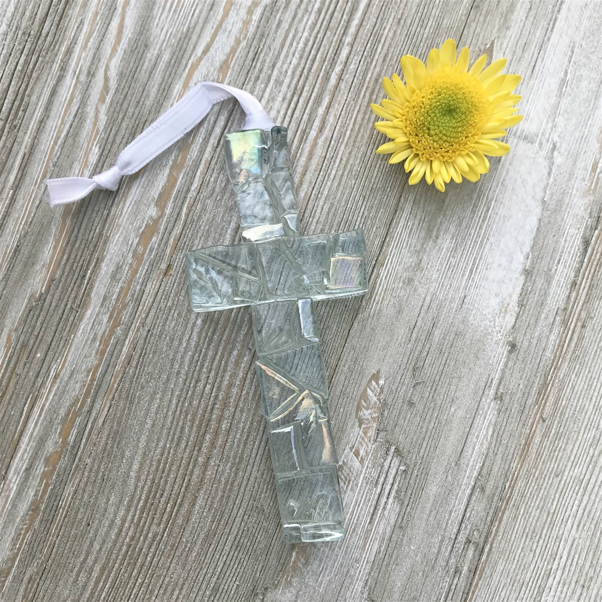 Iridescent clear mosaic cross with white satin ribbon for hanging.