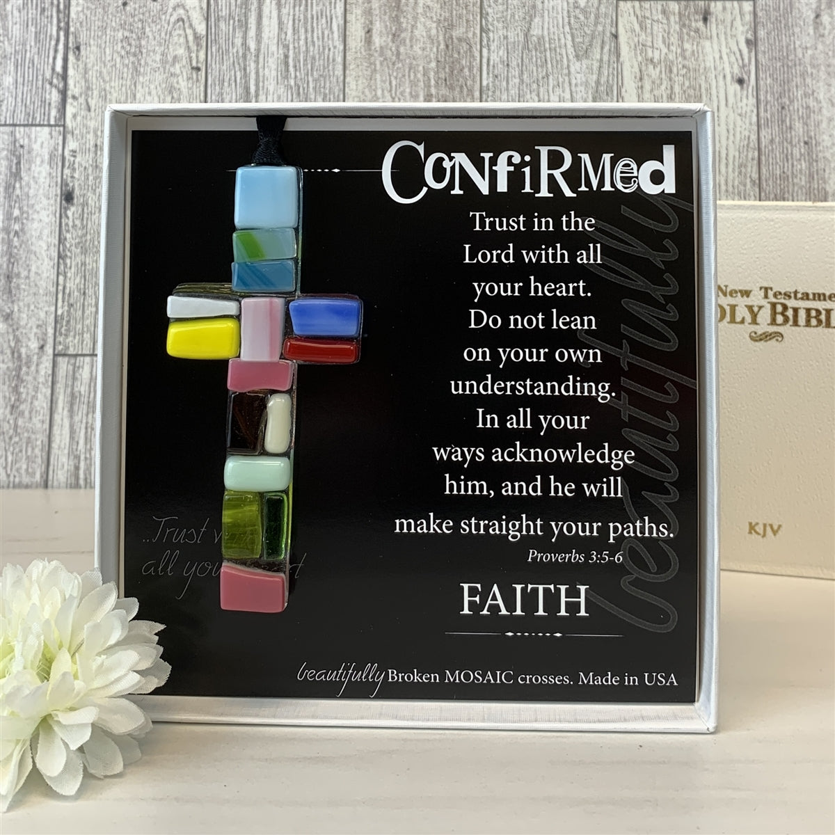 Confirmed glass mosaic cross with bible in background.