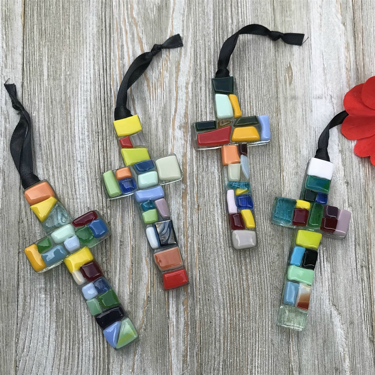An assortment of multi-colored glass mosaic ornaments.