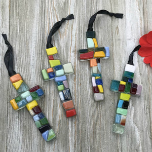 3 of 5:An assortment of multi-colored glass mosaic ornaments.