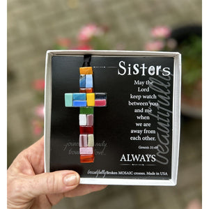 6 of 6:Sister cross gift box being held in a hand.