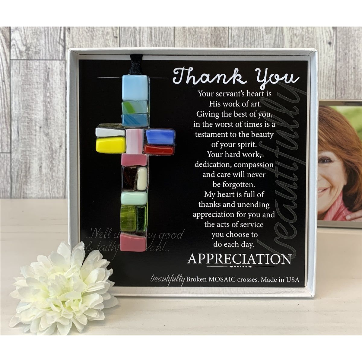 Thank You glass mosaic cross with photo in background.