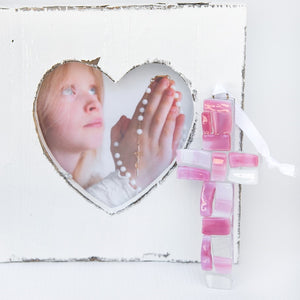 3 of 4:A pink mosaic cross with white satin ribbon for hanging.