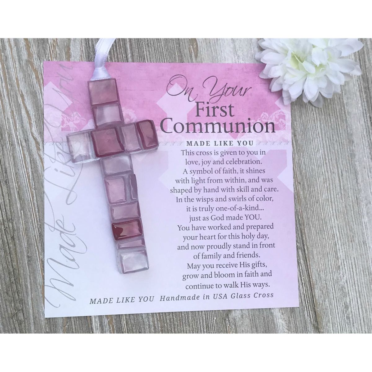 Pink Mosaic cross with shades of pink, white, and clear lying next to the "On Your First Communion" sentiment artwork.