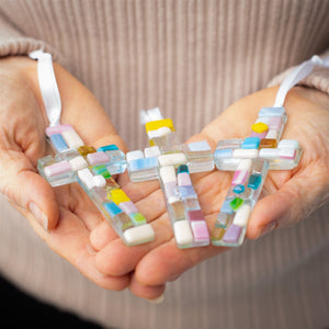 3 of 3:An assortment of pastel mosaic crosses with varying shades of pastel glass.