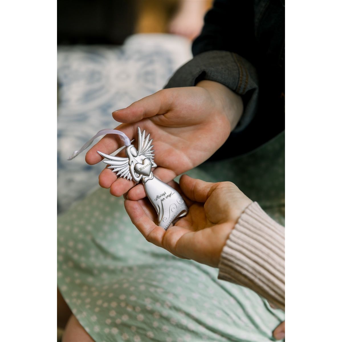 Holding the blessed angel in hands.