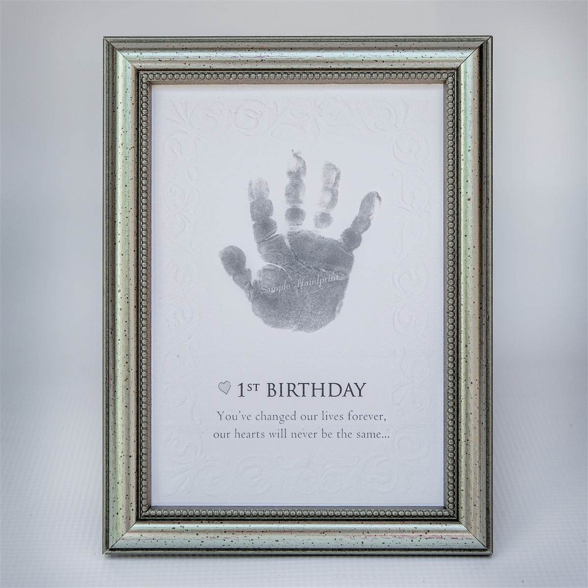 1st Birthday handprint keepsake in elegant frame in silver with embossed beaded design.