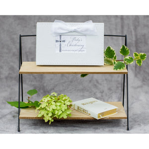 2 of 6:Baby's Christening photo book on bookshelf.