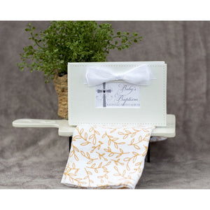 5 of 6:Baby's Baptism photo book in a decorative setting.