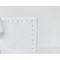 4 of 6:Detailed view of the stitching on the edge of the photo book.