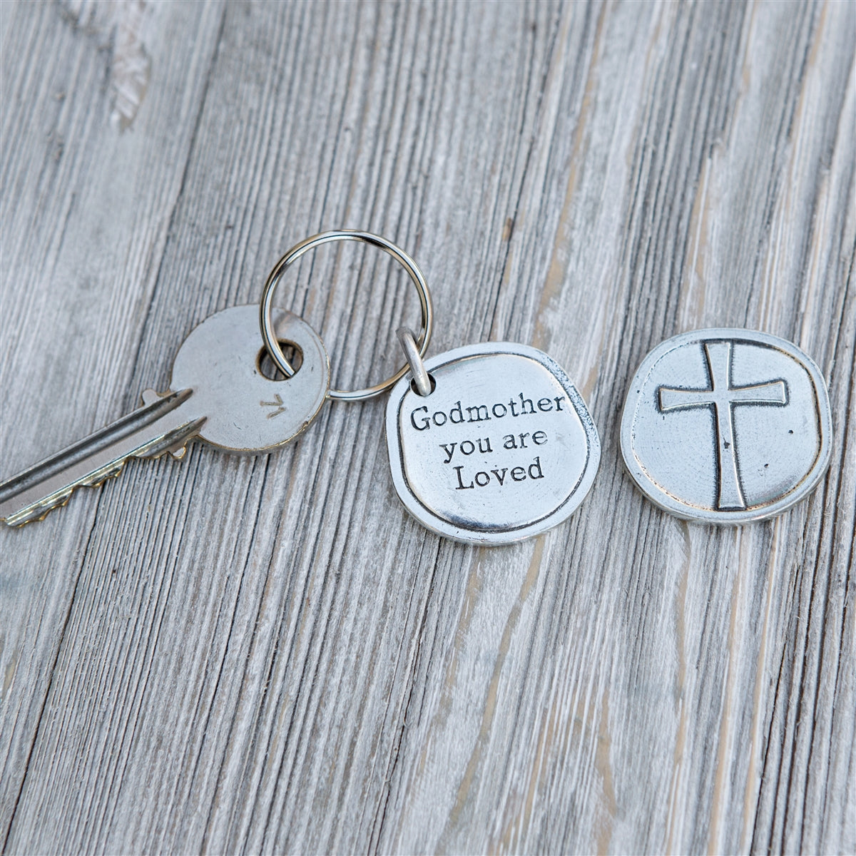 Pewter coin keychain with "Godmother you are Loved" on front and cross on the back.