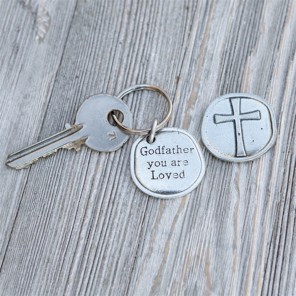 Pewter coin keychain with "Godfather you are Loved" on front and cross on the back.