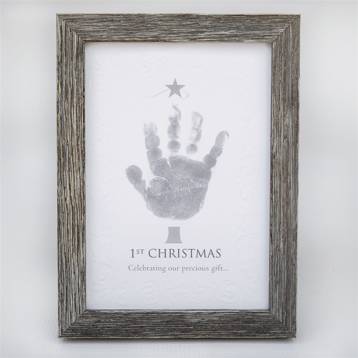 5x7 farmhouse frame with &quot;1st Christmas&quot; sentiment on embossed cardstock with space for a child&#39;s handprint.