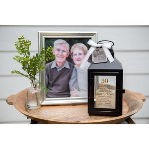 2 of 6:50th Anniversary Lantern in front of a photo of a happy couple.