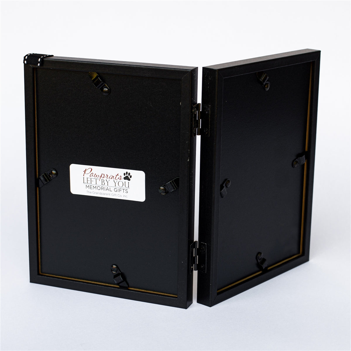 Back of black 5x7 hinged double frame.
