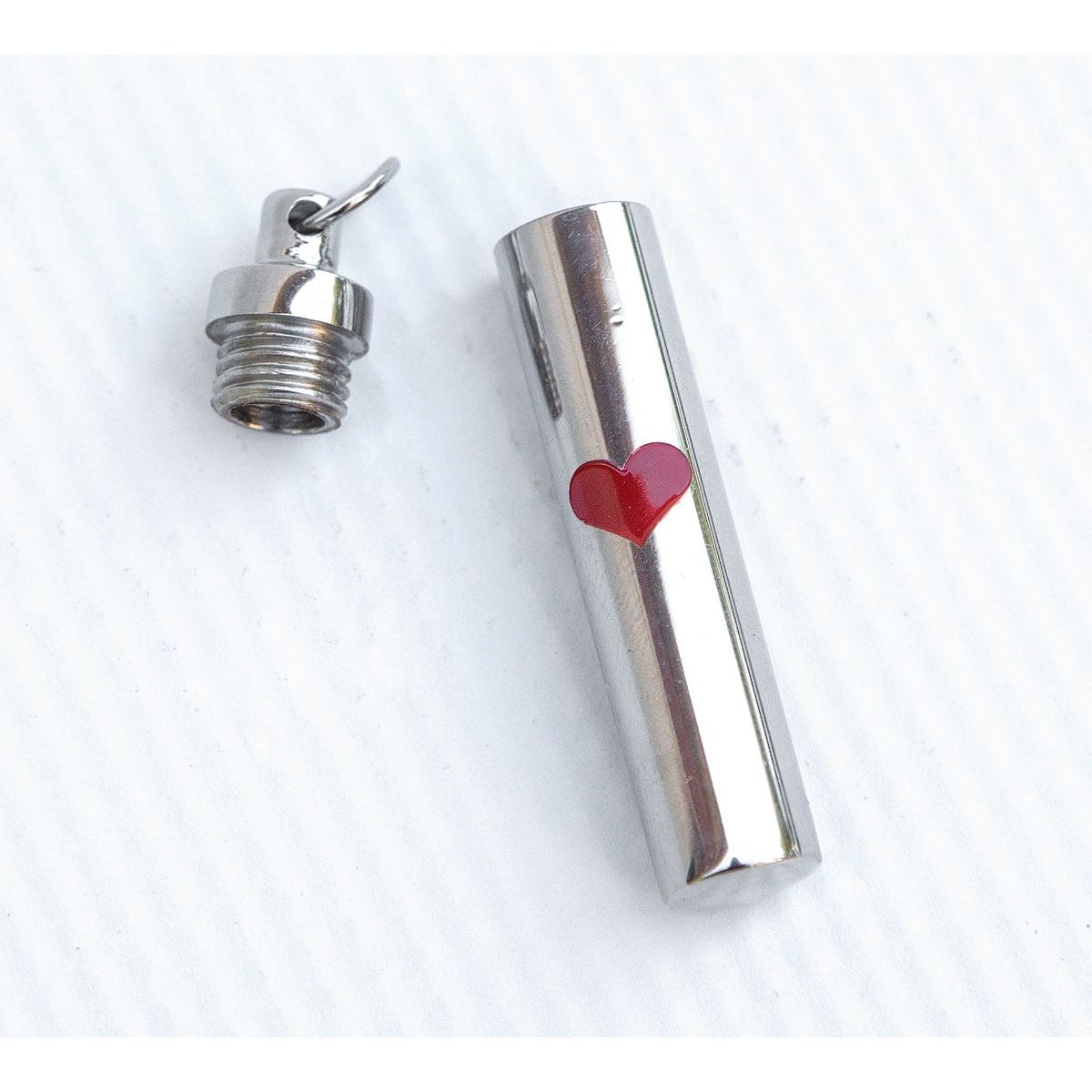 Stainless steel ash/keepsake vial.