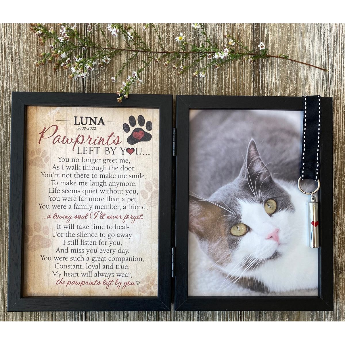 Frame features a black grosgrain ribbon with white stitching that holds an ash/keepsake vial.