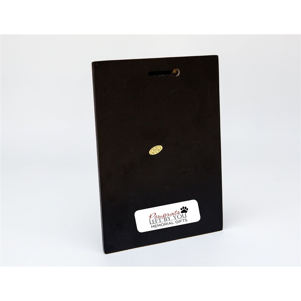 Back of plaque showing key hole for hanging..