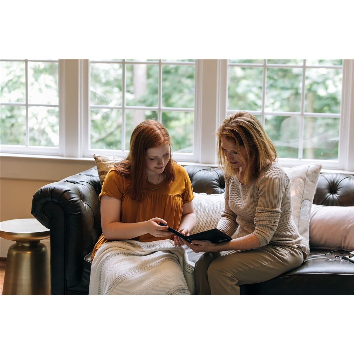 Two women admiring the frame.