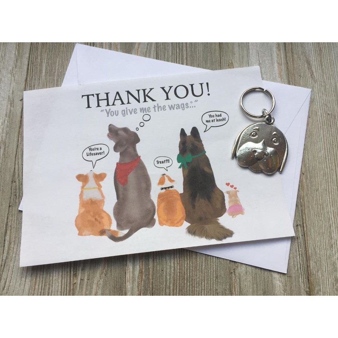 Front of Dog Lover Thank You gift card with drawings of dogs and sentiment. Card is packaged with keychain and envelope.