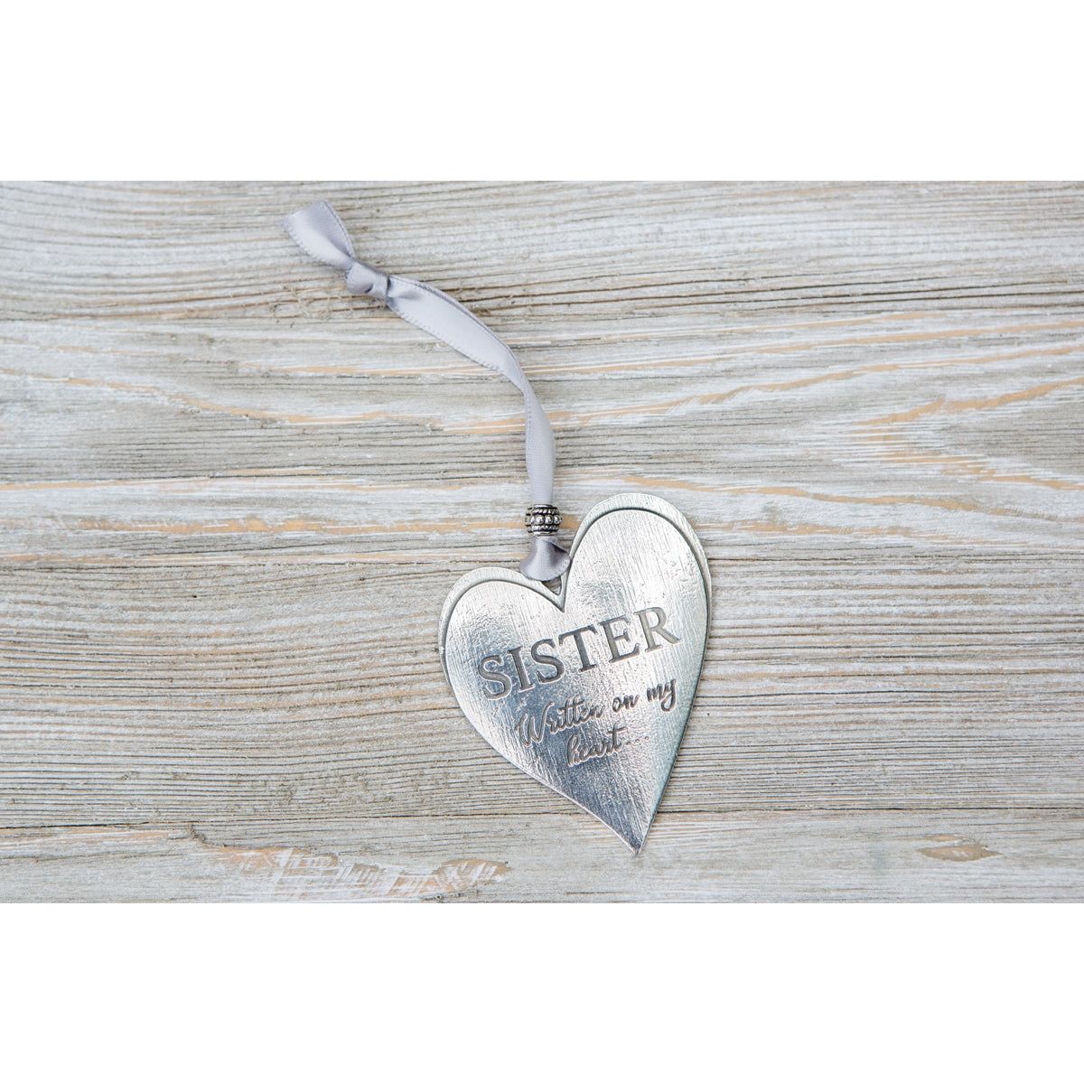 Pewter heart with gray satin for hanging.