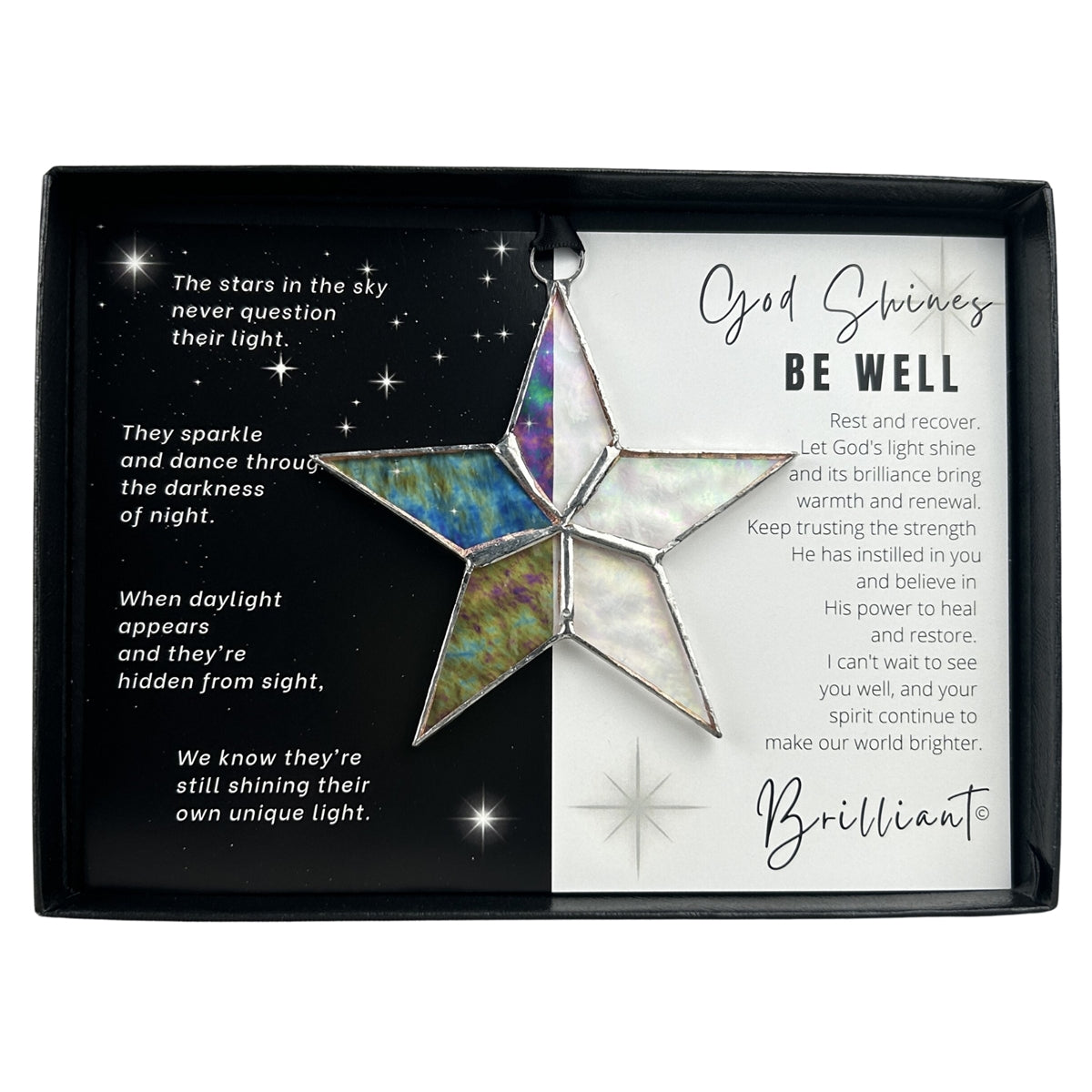 Handmade 4" clear iridescent stained glass star with silver edging, packaged with "God Shines Be Well" sentiment in black gift box with clear lid.