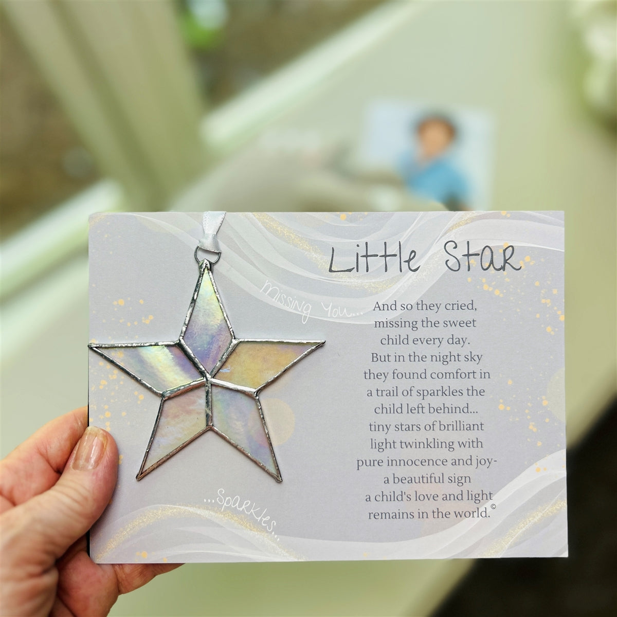 Little Star infant loss gift being held in a hand.