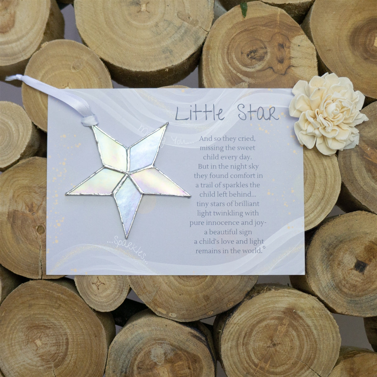 Clear iridescent star with white ribbon and little star poem.