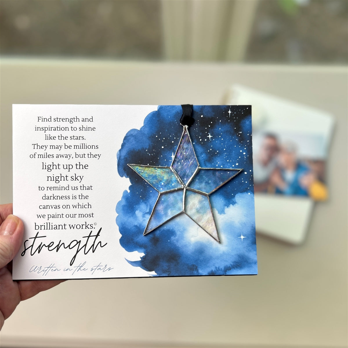 Strength encouragement gift being held in hand.