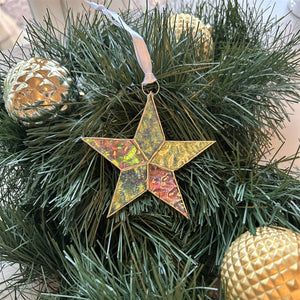 4 of 7:Clear iridescent star with white satin ribbon for hanging.