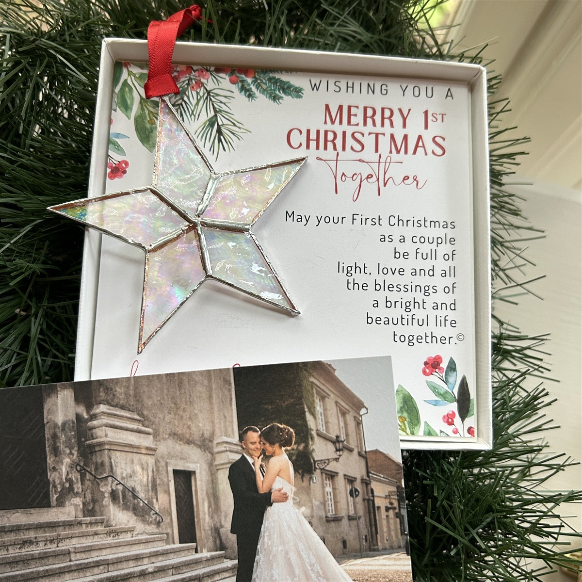 First Christmas Together star ornament boxed with a couple&#39;s wedding photo in the foreground.
