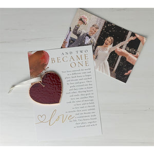 2 of 7:Red heart and sentiment with wedding couple in the background