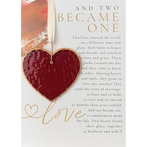 3 of 7:Sentiment and red stained glass heart with the light shining on it to show the texture of the glass