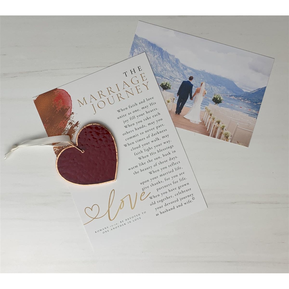 Red heart and sentiment with wedding couple in the background