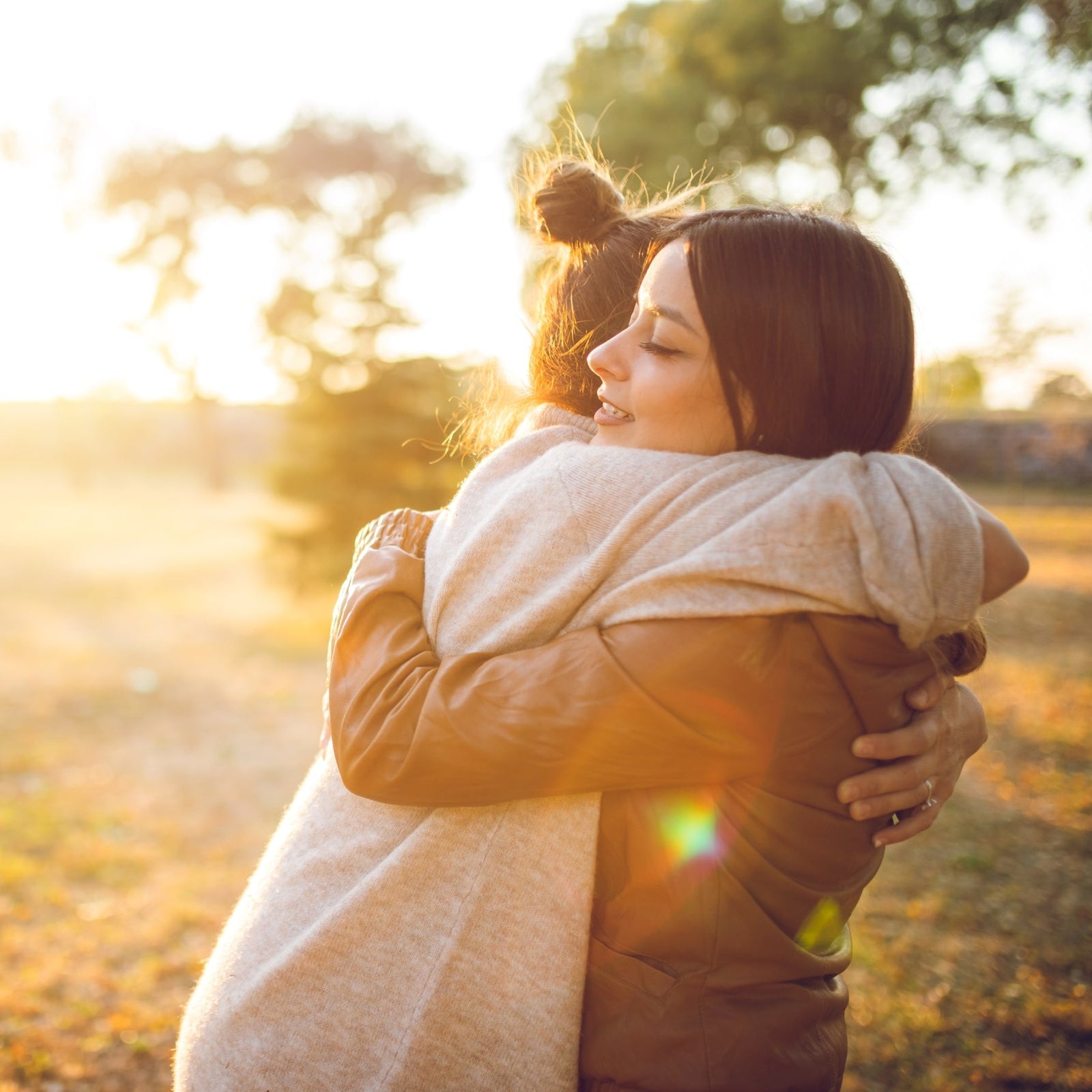 Two women hugging.