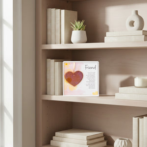 6 of 6:Pink rose mauve glass heart gift for friend on a bookshelf.