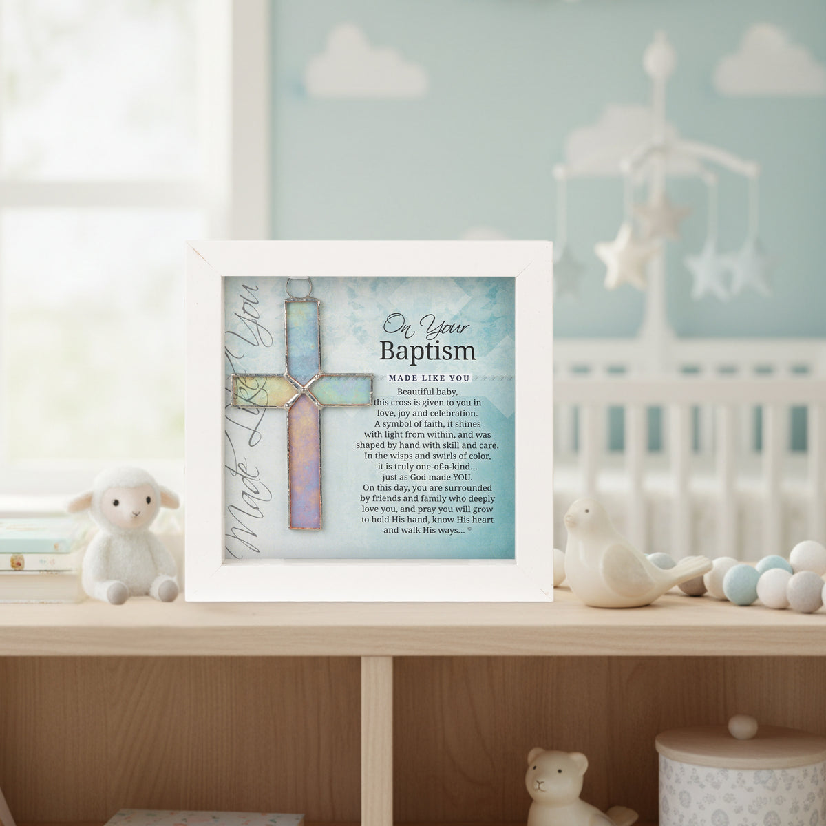 Baptism gift on a shelf in a baby's room.